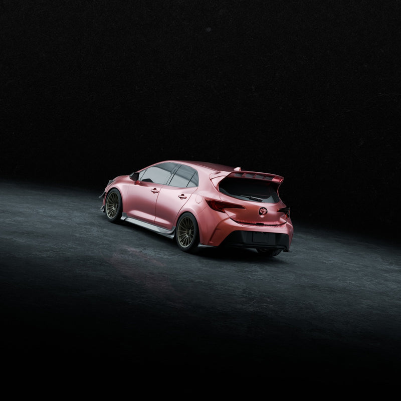 Load image into Gallery viewer, Gloss black rear spats on a metallic pink Toyota Corolla Hatchback (E210) against a dark concrete background.