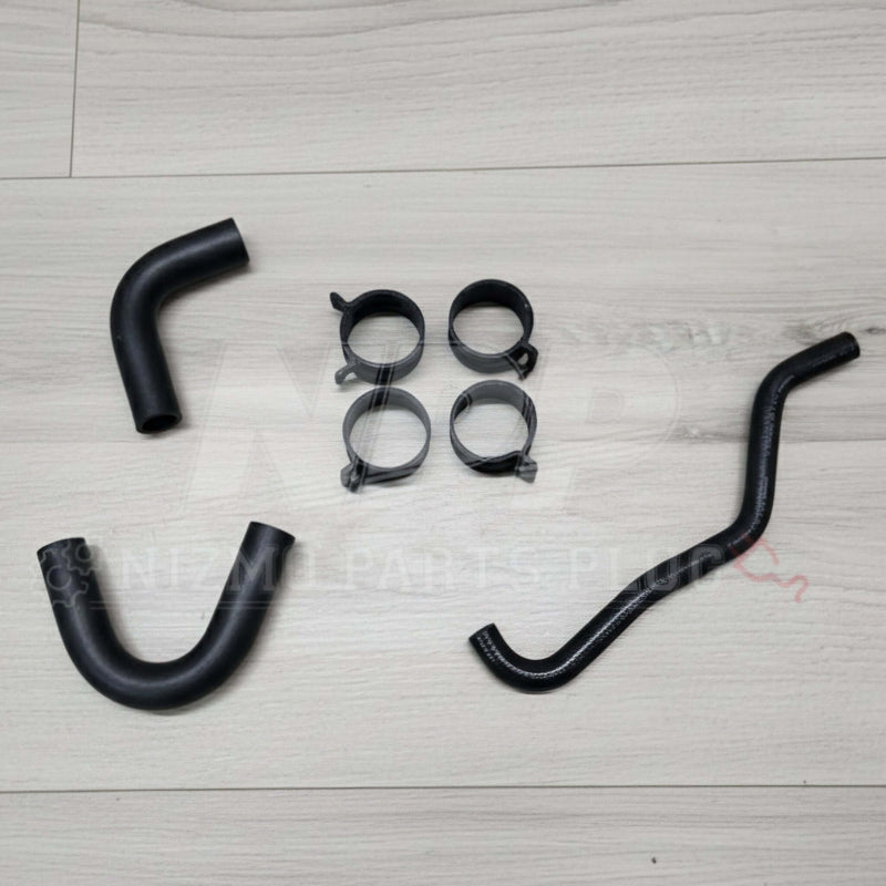 Load image into Gallery viewer, Black Nissan RB26DETT oil cooler hose and clamp kit, new condition, includes three rubber hoses and four metal clips.
