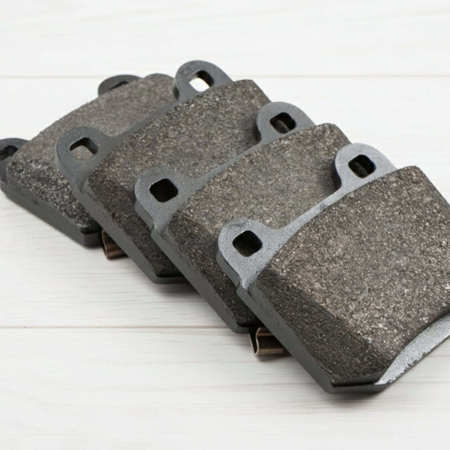 Nissan R34 GTR Z33 350Z Rear Brake Pad Set (Brembo Caliper) on a wooden surface.