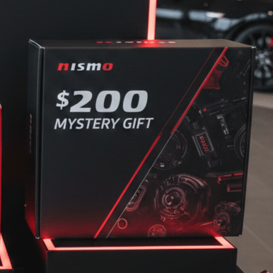 Load image into Gallery viewer, Nismo Heritage mystery box for JDM Nissan parts, featuring a black box with red accents and automotive components graphics.