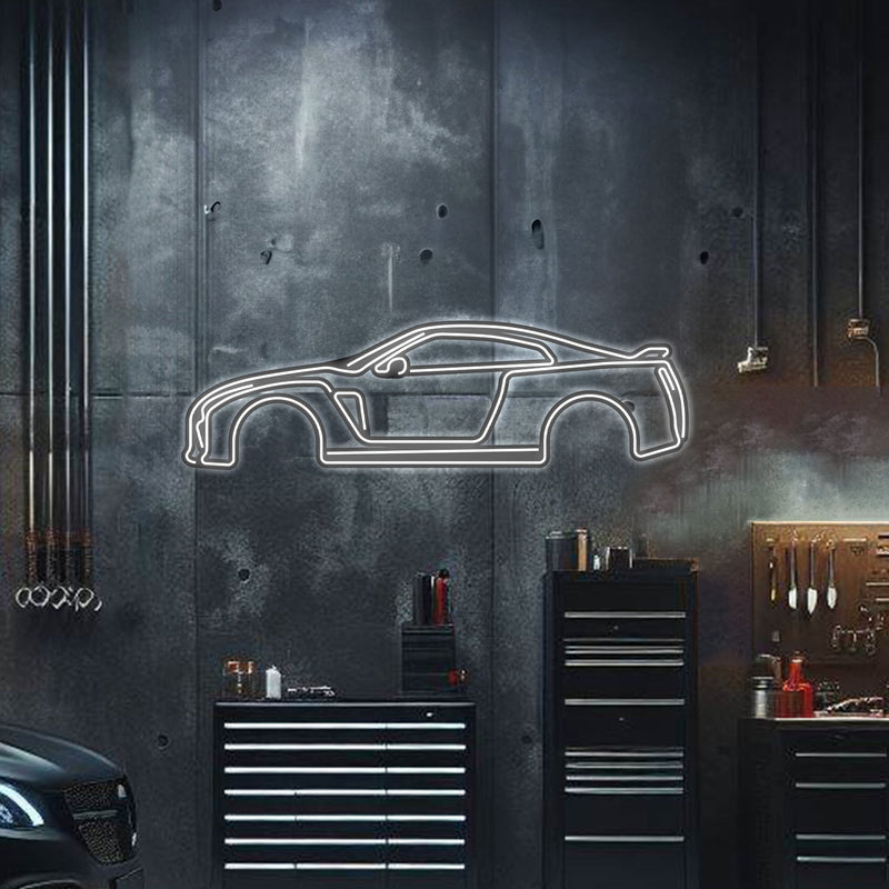 Load image into Gallery viewer, White neon outline wall art of a Nissan Skyline GT-R R35 profile mounted on a dark industrial wall.