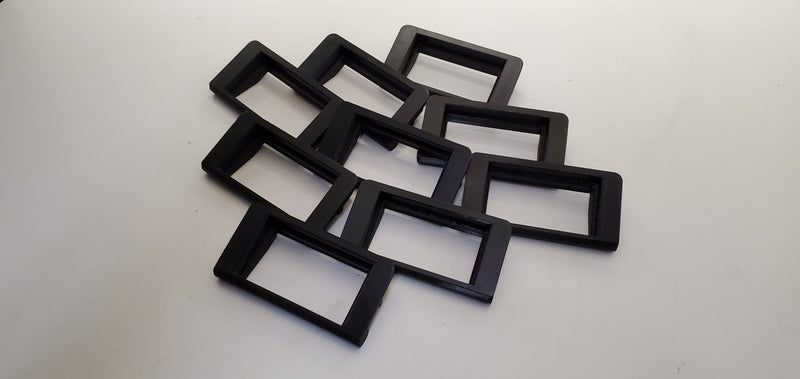 Load image into Gallery viewer, Stack of black plastic HKS EVC boost controller mounts for Nissan Skyline R32.