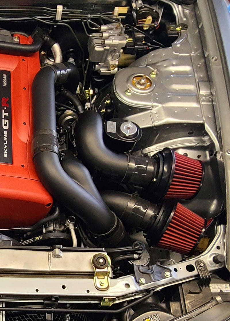 Load image into Gallery viewer, U.P.G. matte black intake piping package with red filters installed in a Nissan R33/R34 Skyline engine bay.