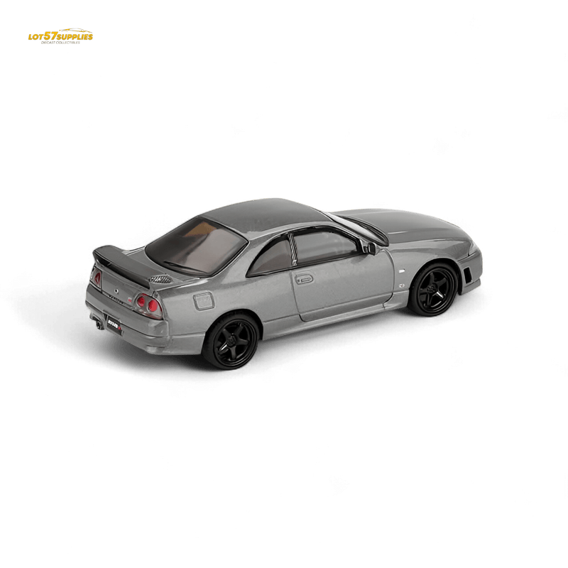 Load image into Gallery viewer, Mini GT Nissan Skyline GT-R BCNR33 CRS diecast model in dark metal gray with black wheels, isolated on black.