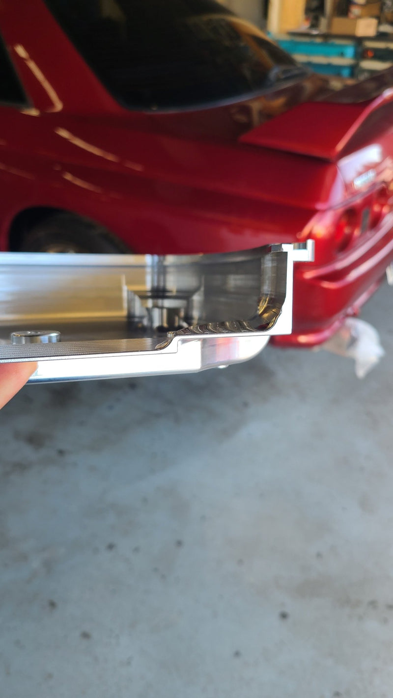 Load image into Gallery viewer, Silver billet aluminum RB26 front cover for Nissan Skyline, showing detailed internal machining.