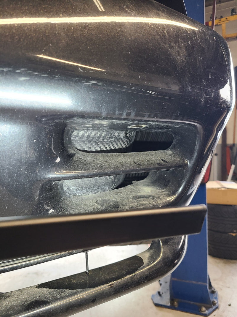 Load image into Gallery viewer, U.P.G oil cooler with carbon fiber ducting installed behind the black bumper of a Nissan R32 GTR.