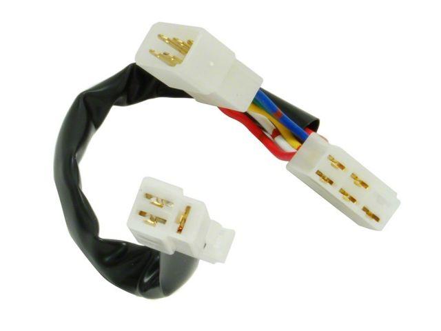 Load image into Gallery viewer, HKS turbo timer harness for Nissan Skyline R33/R34 with white plastic connectors and wrapped multi-colored wiring.