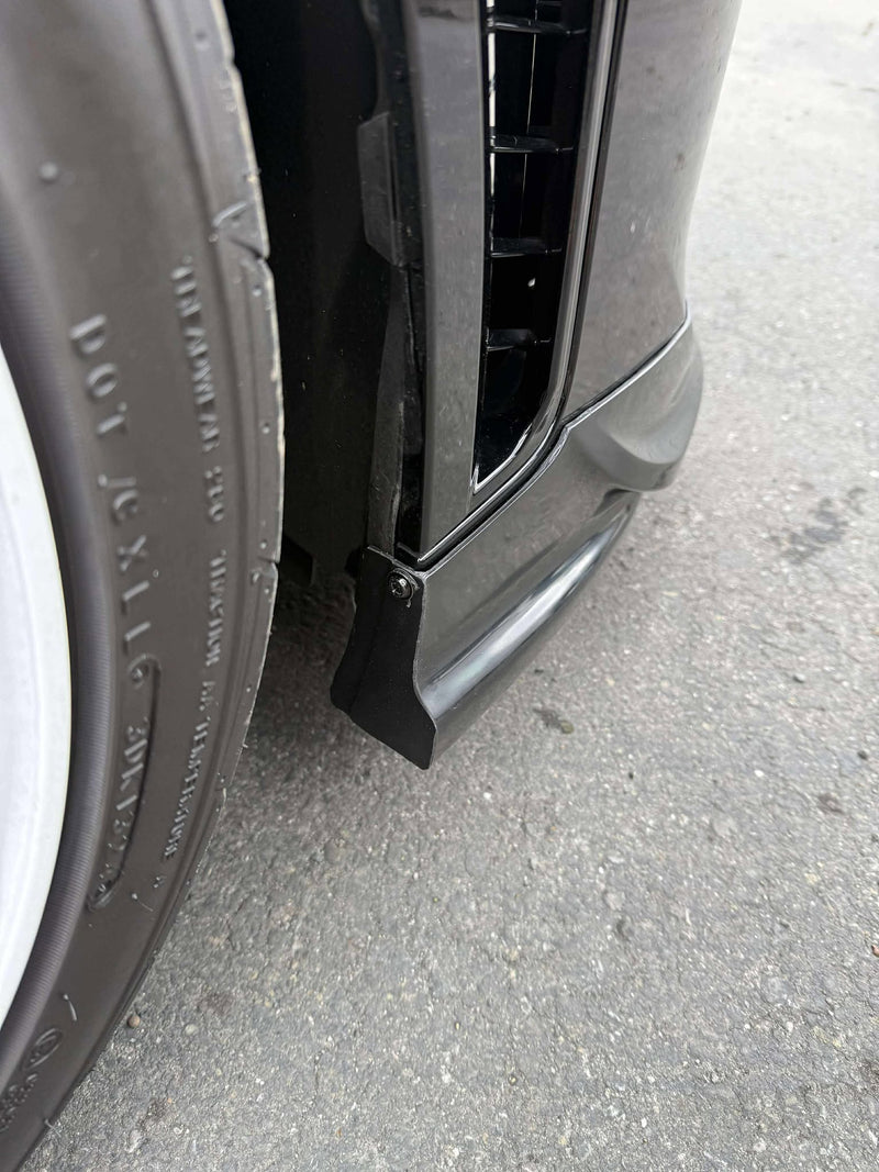 Load image into Gallery viewer, Black front lip installed on a 2025+ Toyota GR Corolla (E210 Kouki), showing fitment by the front wheel.