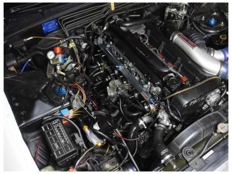 Load image into Gallery viewer, HPS black silicone radiator and heater hose kit installed in a Nissan Skyline R32 GT-R RB26 engine bay.