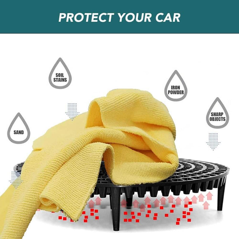 ギャラリービューアに画像をロードする, Black bucket grit guard for car washing, shown with a yellow cleaning cloth and labels for debris like sand and iron.