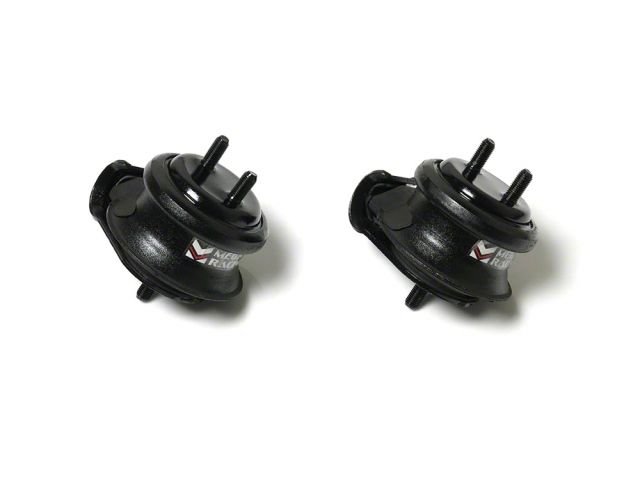 Load image into Gallery viewer, Two black Megan Racing hardened engine mounts for Nissan Skyline R33 and R34 on a white background.
