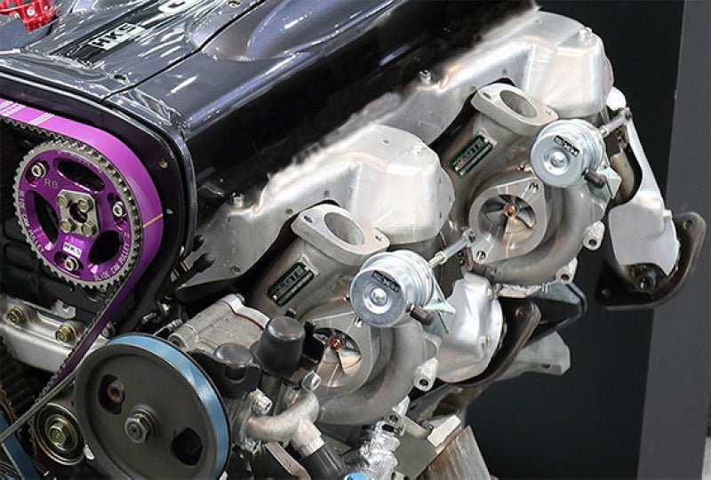 Load image into Gallery viewer, HKS GTIII 2530 SPORTS TURBINE KIT RB26 twin-turbo layout with adjustable performance actuators.