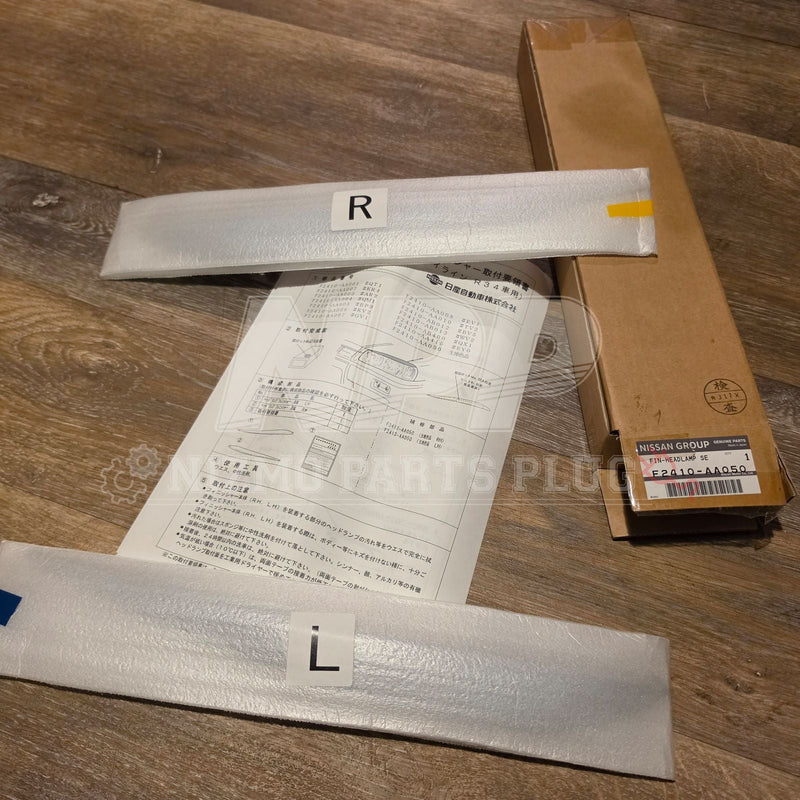 Load image into Gallery viewer, Nissan Skyline R34 Optional NISMO Headlight Eyelids Kit – F2410-AA050