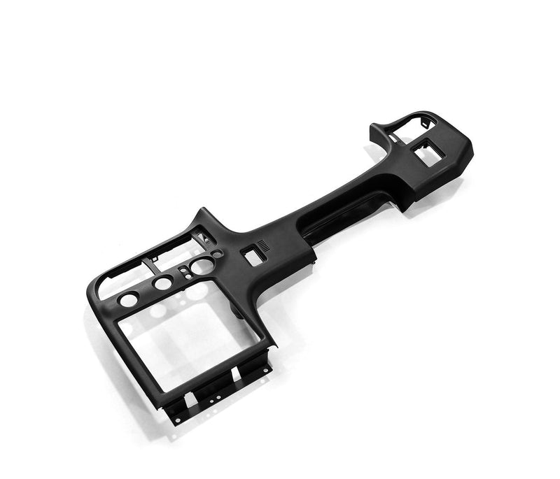 Load image into Gallery viewer, Black R33 Nissan Skyline center dashboard surround assembly on a white background.