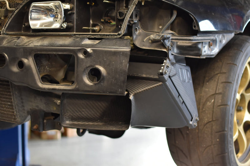 Load image into Gallery viewer, U.P.G oil cooler with black carbon fiber ducting installed on a Nissan R32 GTR.