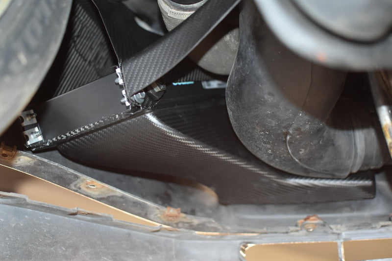 Load image into Gallery viewer, Black carbon fiber oil cooler duct for R32 Nissan GTR, installed near the bumper and radiator.