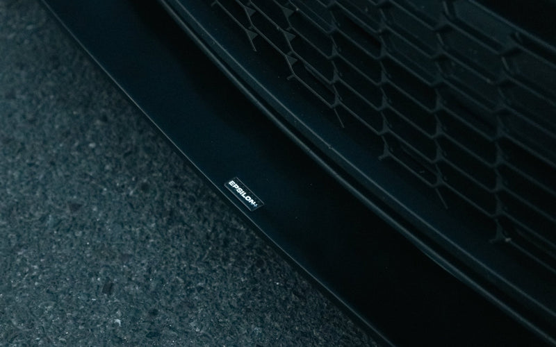 Load image into Gallery viewer, Matte black V2 front lip for Toyota GR Corolla (E210, 2023-2024) with Epsilon+ emblem detail.