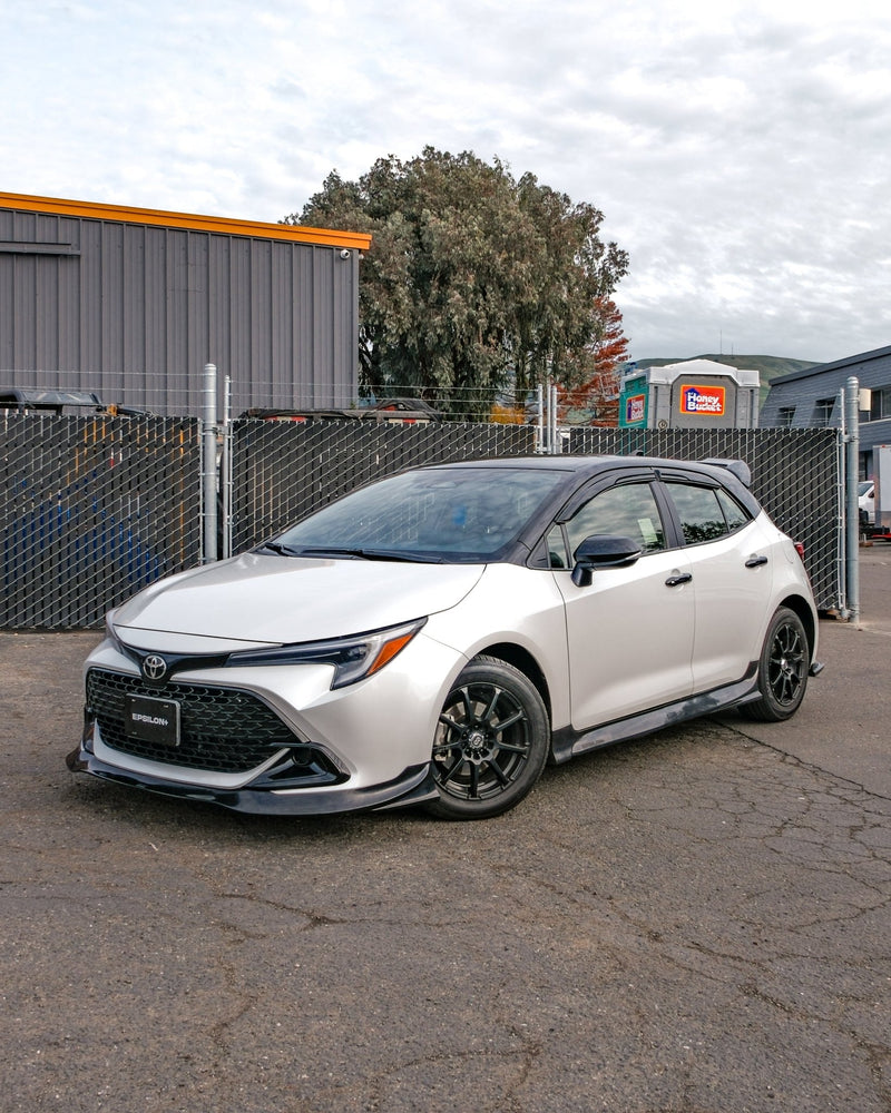 Load image into Gallery viewer, Gloss black front lip on a silver Toyota Corolla Hatchback (E210, 2023+ Kouki).