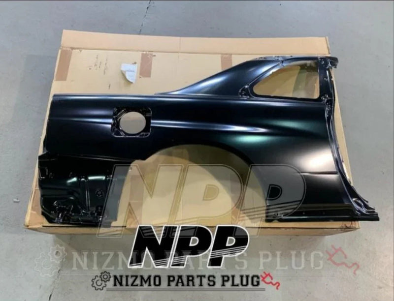 Load image into Gallery viewer, Black Nissan rear quarter panel car part on cardboard, Nismo Parts Plug branding visible.