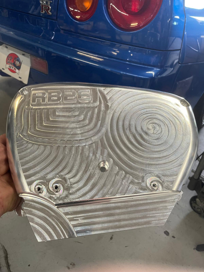 Load image into Gallery viewer, Polished billet aluminum RB26 engine front cover for Nissan Skyline GT-R with visible CNC machined swirl details.