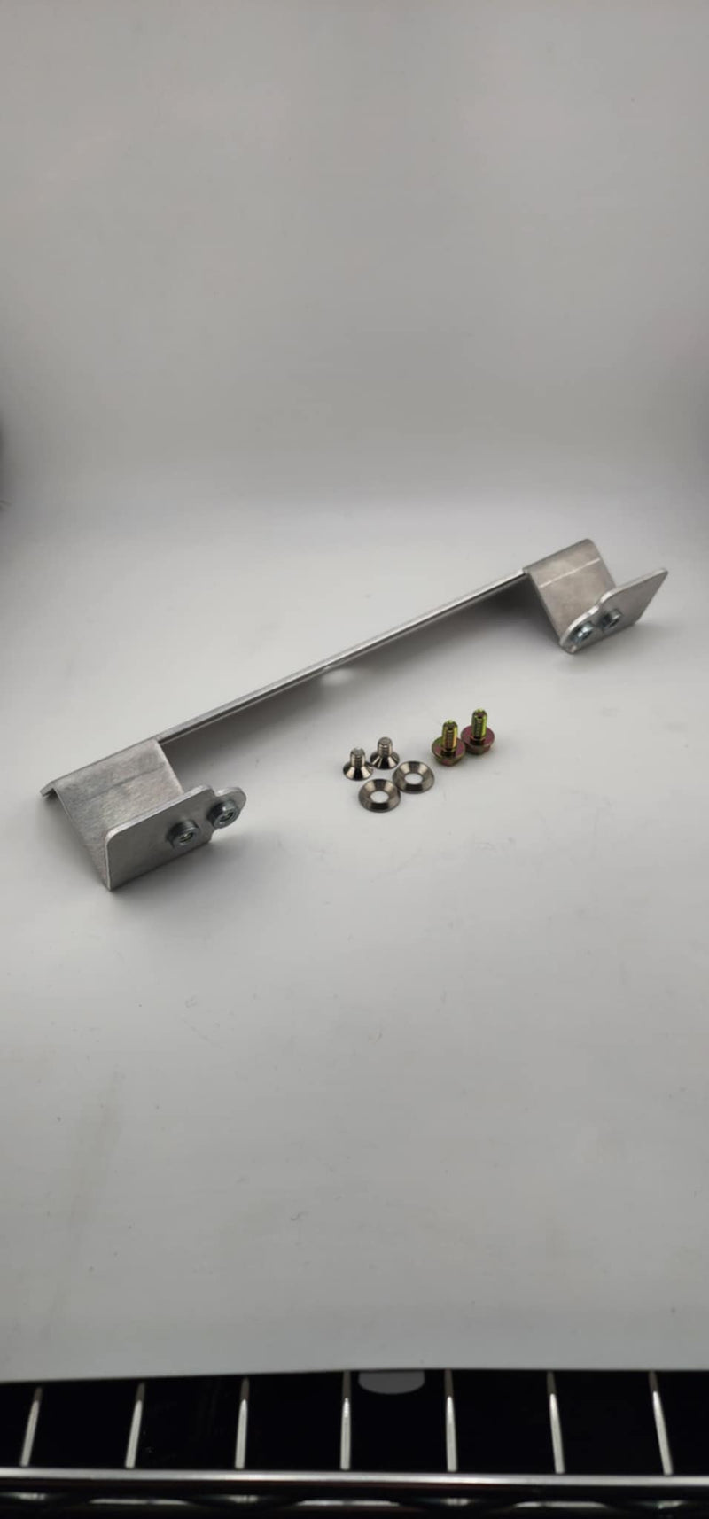 Load image into Gallery viewer, R32/33 Skyline Front Bumper Conversion License Plate Mounting Bracket - NizmoPartsPlug