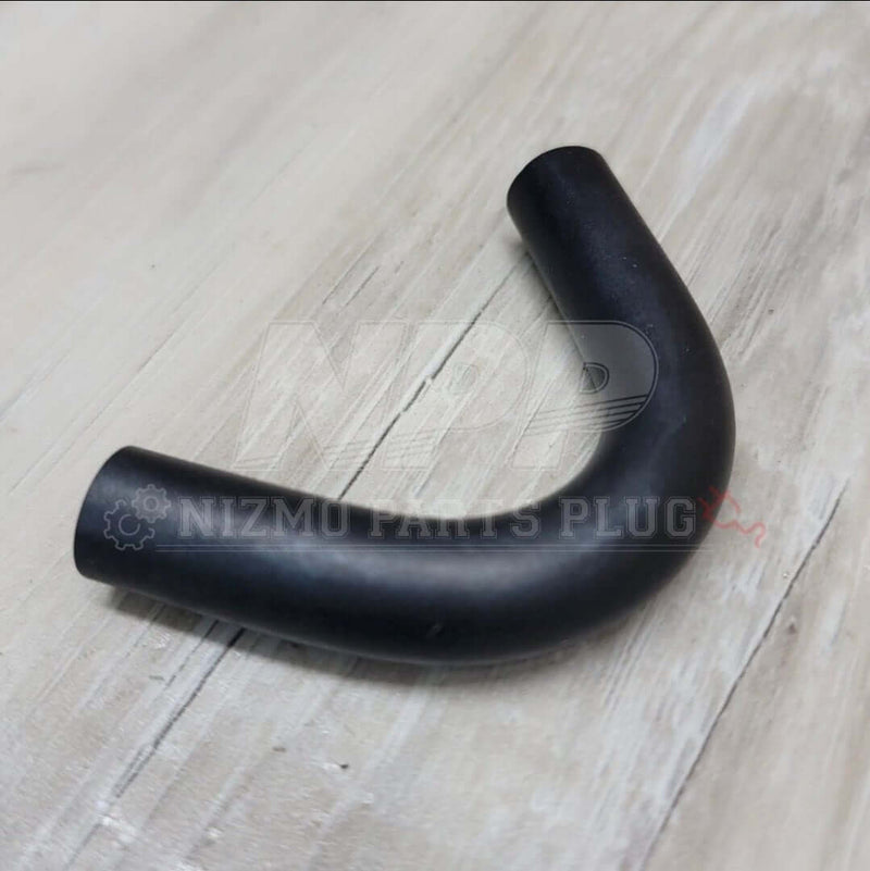 Load image into Gallery viewer, Black J-shaped oil cooler hose for Nissan RB26DETT engine (R32, R33, R34). New condition.
