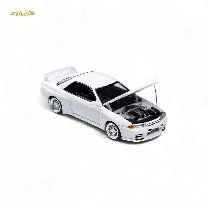 Load image into Gallery viewer, White 1:64 scale Focal Horizon Nissan Skyline GT-R R32 Nismo S-Tune model car with open hood.