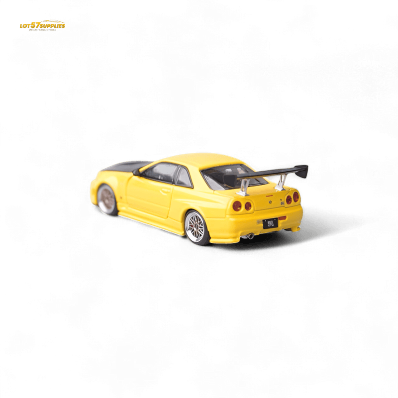 Load image into Gallery viewer, Yellow 1:64 scale Focal Horizon Nissan Skyline GT-R R34 Z-Tune diecast model with a carbon-look hood and rear wing.