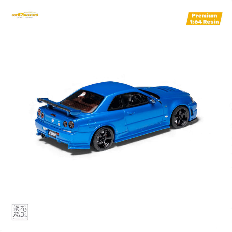 Load image into Gallery viewer, 1:64 scale resin model of a Bayside Blue Nissan Skyline GT-R R34 Z-Tune with black wheels on a black background.