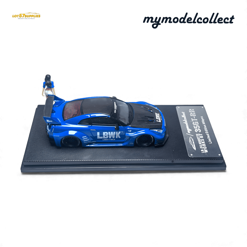 ギャラリービューアに画像をロードする, 1:64 scale blue Nissan R35 GT-R LB Works diecast model with carbon hood and display stand, including a figure.