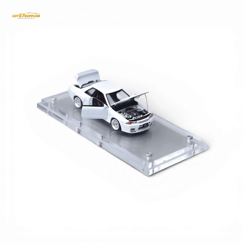 Load image into Gallery viewer, 1:64 scale white Nissan Skyline GT-R R32 Nismo S-Tune model car with opening hood, doors, and trunk on a display base.