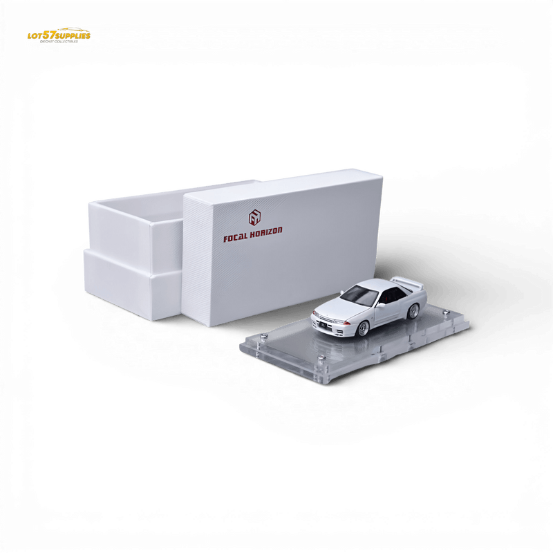 Load image into Gallery viewer, Focal Horizon 1:64 white Nissan Skyline GT-R R32 Nismo S-Tune diecast model on a display stand with white box.