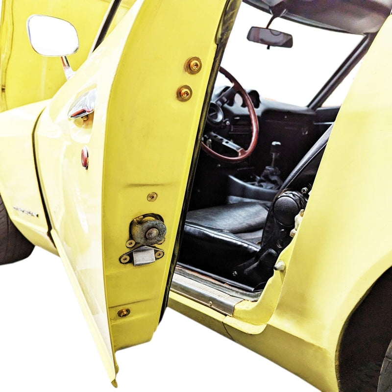Load image into Gallery viewer, ZSPEC titanium door jam fastener kit installed on a yellow Datsun S30 (240Z/260Z/280Z).