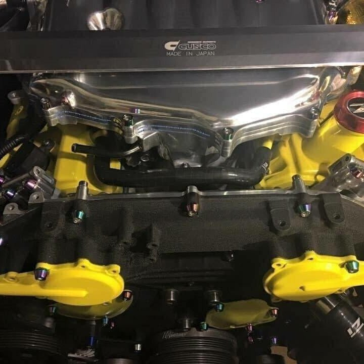 Load image into Gallery viewer, ZSPEC stainless/billet fastener kit on '03-08 Infiniti G35 engine with yellow components and rainbow-finish bolts.