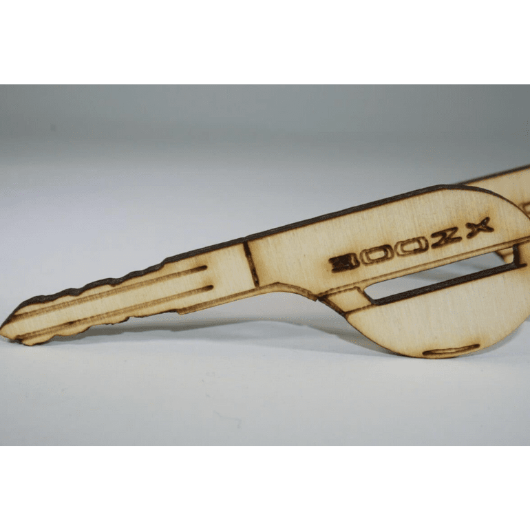 Load image into Gallery viewer, Laser-engraved wooden key ornament for Nissan 300ZX Z32, featuring light birch finish and detailed key profile.