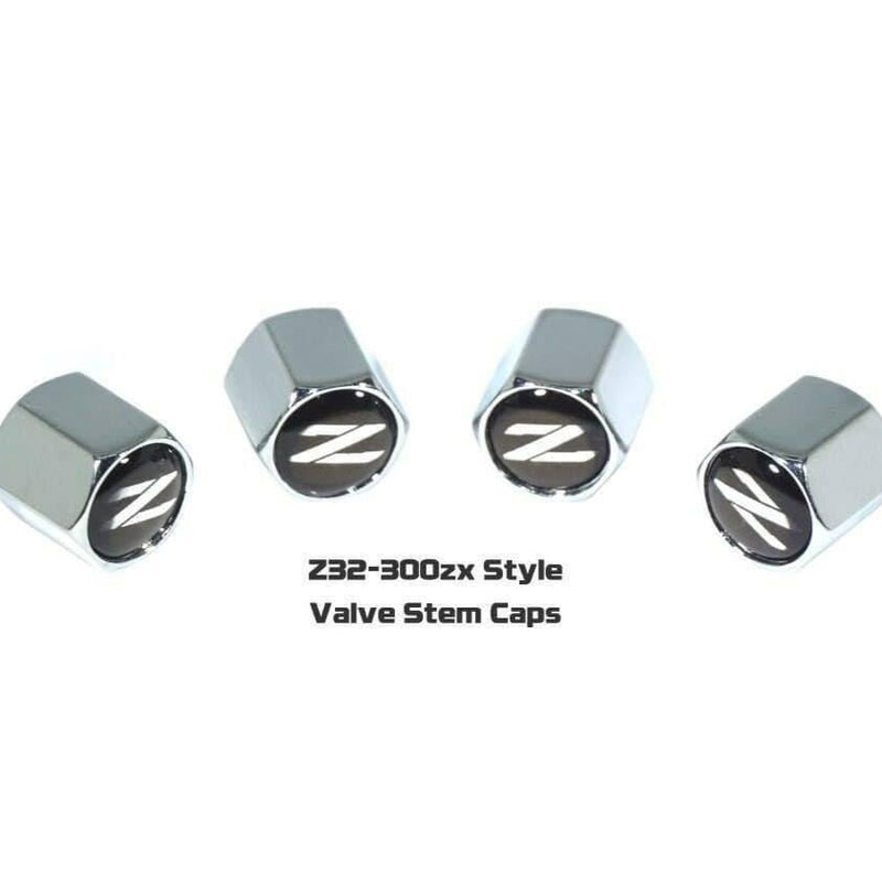 Load image into Gallery viewer, Four chrome Nissan 300ZX Z32 style valve stem tire caps with black and silver "Z" logos on a white background.