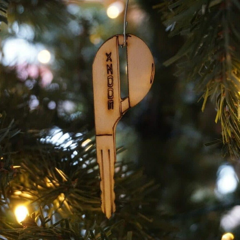 Load image into Gallery viewer, Laser-engraved birch wood ornament shaped like a Nissan 300ZX Z32 key hanging on a Christmas tree.