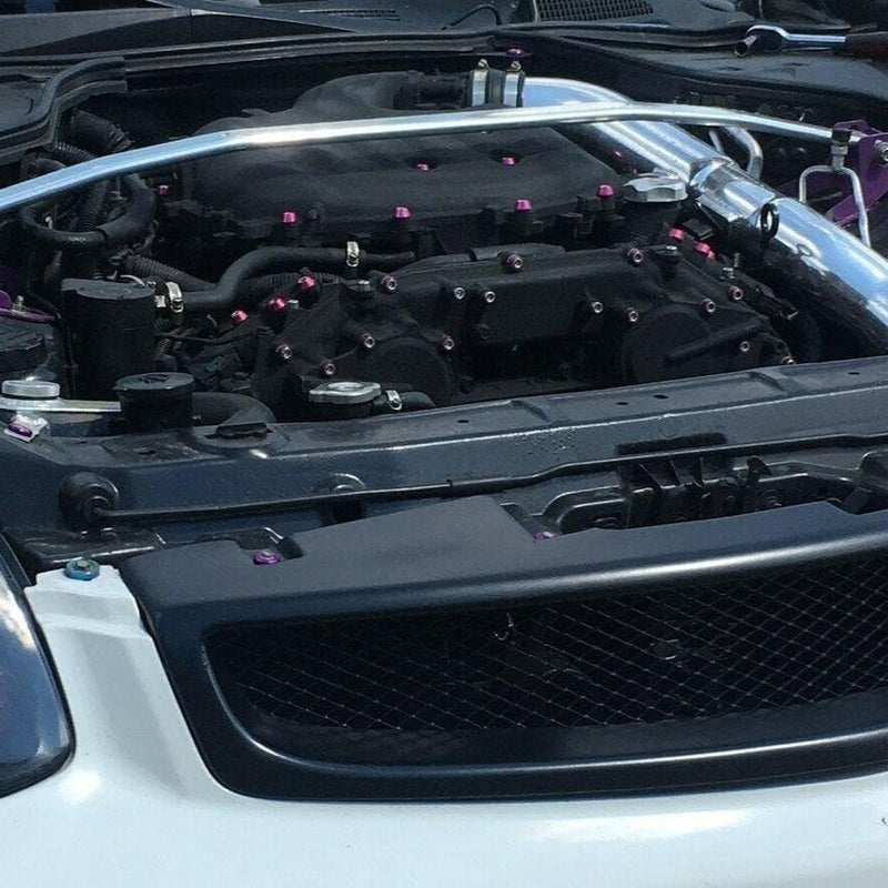 Load image into Gallery viewer, ZSPEC fastener kit with purple billet accents installed on a 2003-2008 Infiniti G35 engine bay.