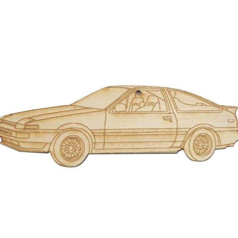Cargue la imagen en el visor de la galería, 5-inch light wood laser-engraved ornament of a Toyota Corolla AE86 with detailed interior and wheel outlines.