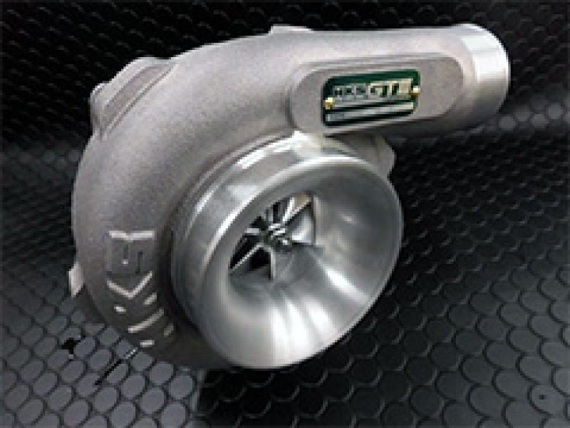 Load image into Gallery viewer, HKS turbine kit for Nissan S14/S15 SR20DET. Silver metal turbocharger with HKS logo, shown on black textured background.