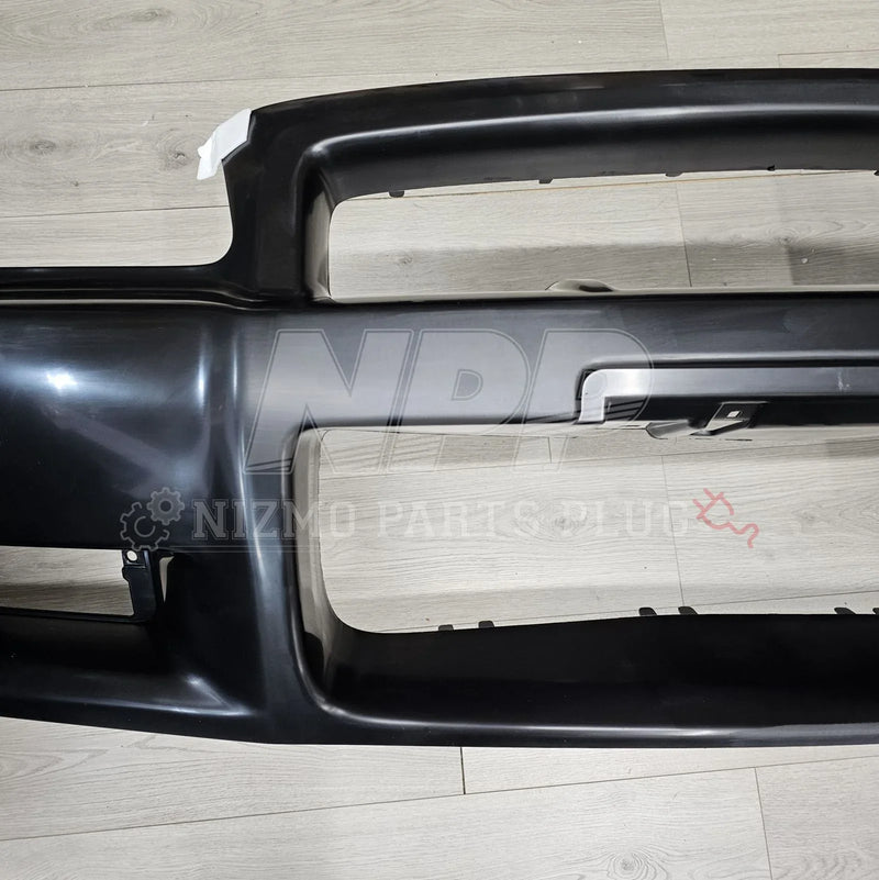 Load image into Gallery viewer, Nissan R34 Skyline GT-R Standard Front Bumper Assembly - NizmoPartsPlug