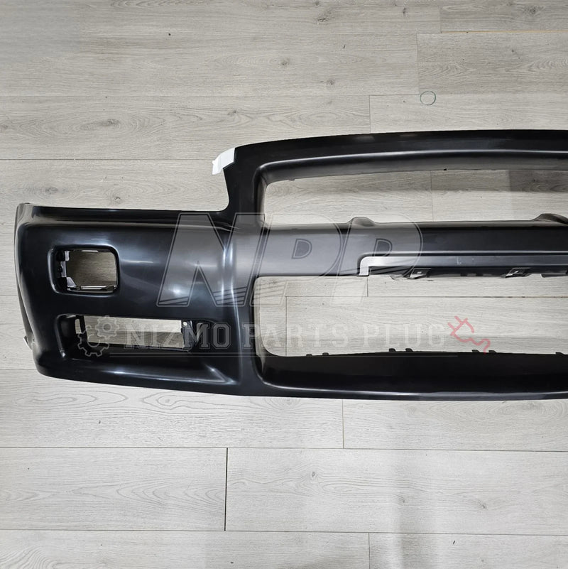 Load image into Gallery viewer, Nissan R34 Skyline GT-R Standard Front Bumper Assembly - NizmoPartsPlug
