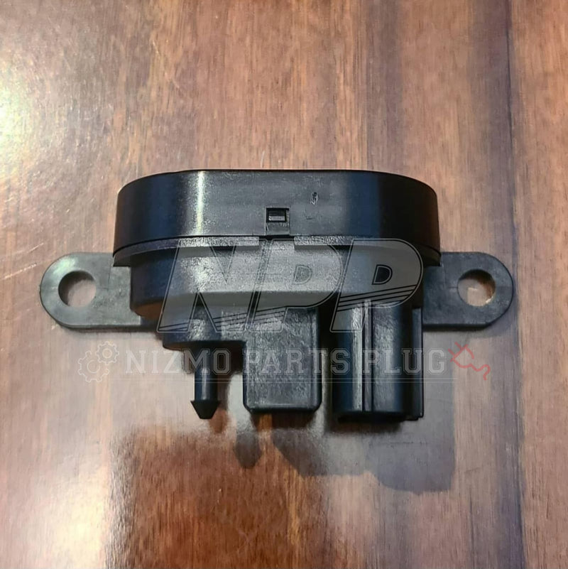 Load image into Gallery viewer, Black Nissan R34 Skyline turbo boost sensor solenoid in good condition, shown against a wooden surface.