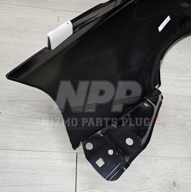 ギャラリービューアに画像をロードする, New black RH front fender for Nissan Skyline R34 GTR, featuring factory mounting bracket and protective edge trim.