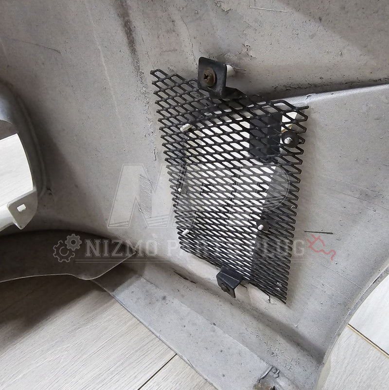 Load image into Gallery viewer, Interior view of a pre-owned Nissan S15 Silvia Aero front bumper showing a black metal mesh grill insert.