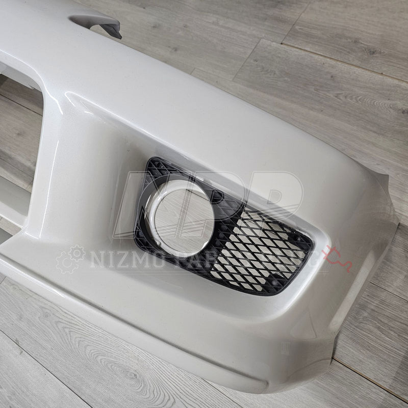 Load image into Gallery viewer, Pre-owned white Nissan S15 Silvia Spec-R Aero front bumper assembly with black fog light bezel and mesh grille.