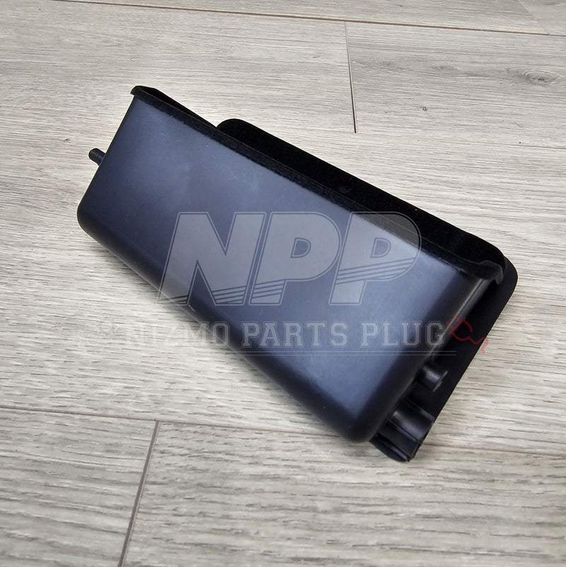 Load image into Gallery viewer, Black Nissan R34 Skyline fuse block lid for lower dash, in excellent clean condition.