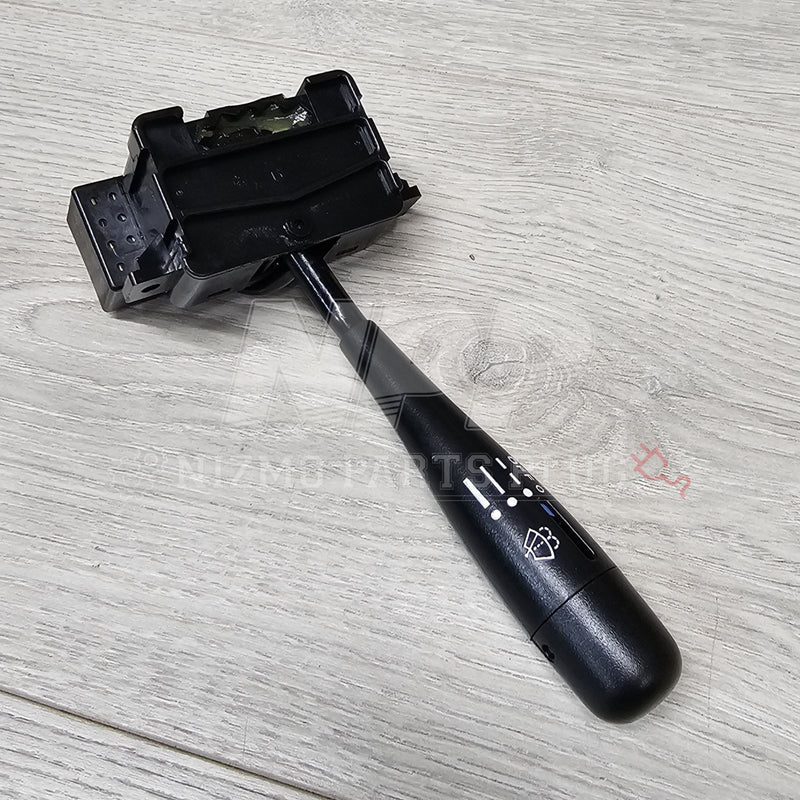 Load image into Gallery viewer, Black Nissan S13 240sx USDM wiper switch assembly on a light wood grain surface.