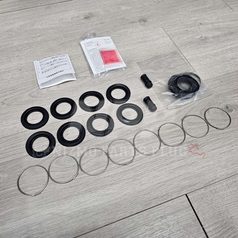 Load image into Gallery viewer, Nissan R34 Skyline GTT Rear Caliper Seal Rebuild Kit - NizmoPartsPlug
