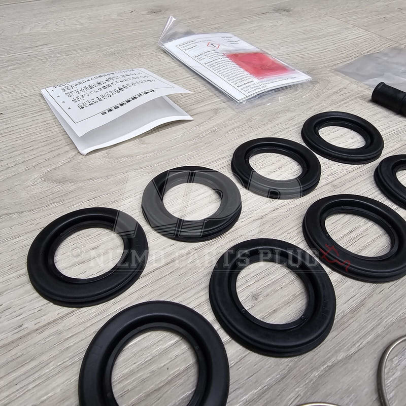 Load image into Gallery viewer, Nissan R34 Skyline GTT Rear Caliper Seal Rebuild Kit - NizmoPartsPlug